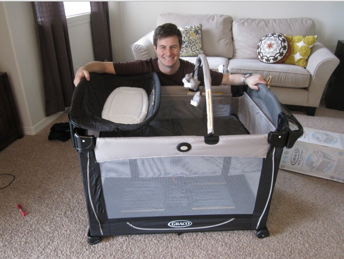 man and babycrib