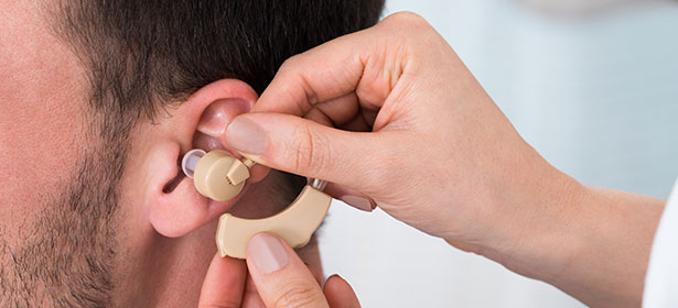 man using hearing aids